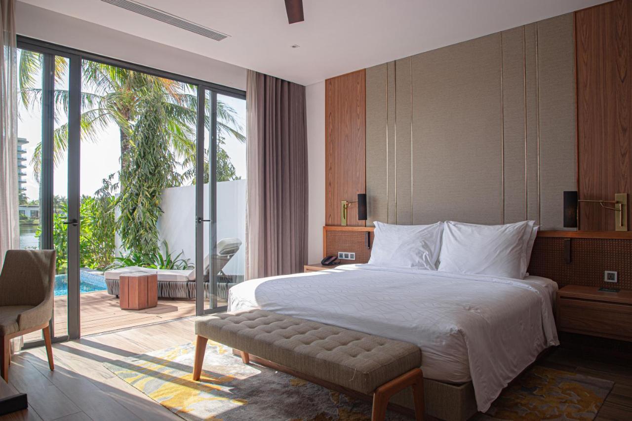 Moevenpick Villas & Residences دونغ دونغ المظهر الخارجي الصورة A bedroom at the hotel