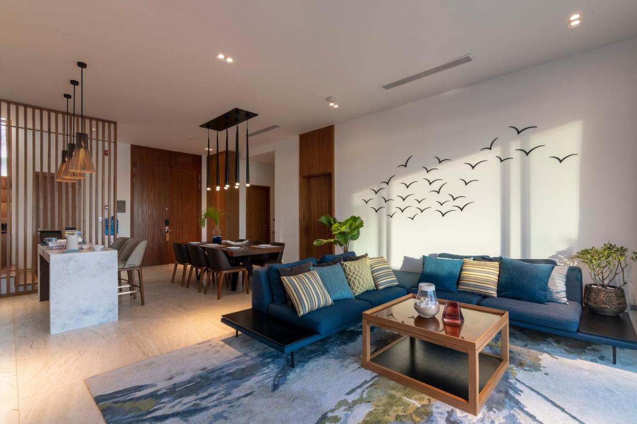 Moevenpick Villas & Residences دونغ دونغ المظهر الخارجي الصورة A living room in a condominium