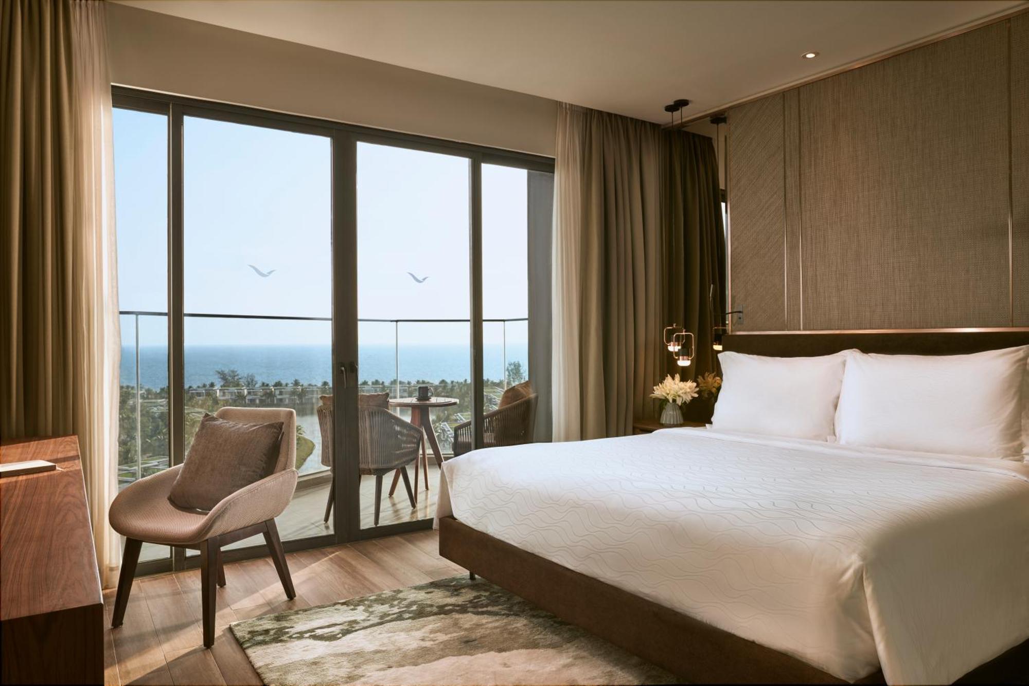 Moevenpick Villas & Residences دونغ دونغ المظهر الخارجي الصورة A bedroom at the hotel